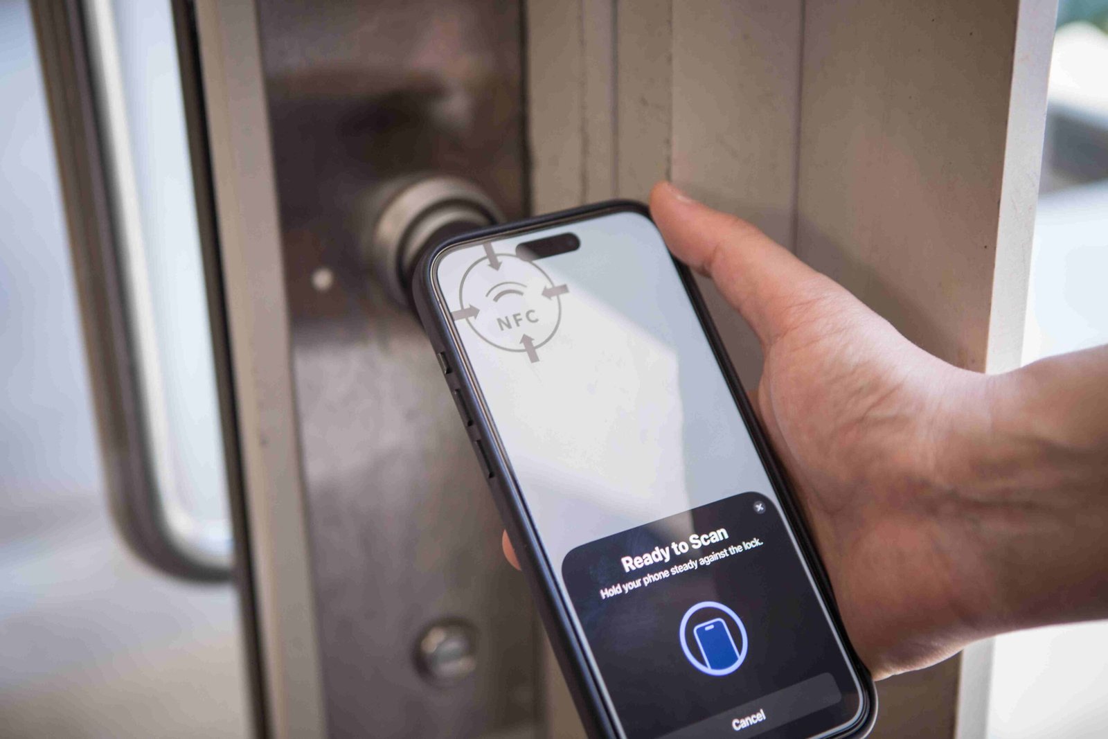 Smartphone app unlocking an iLOQ smart lock